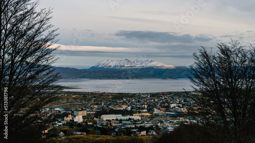 Beagle Channel with the buildings of Ushuaia and the snowy mountain range on the Chilean side. Argentina
