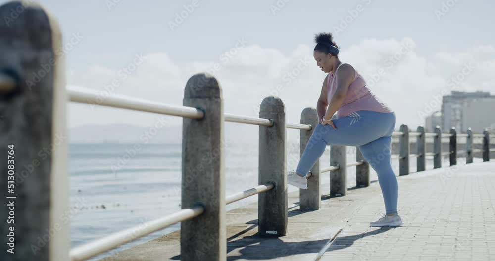 One plus size overweight woman stretching legs to prevent injury for warmup exercise before run on promenade outdoors. Chubby obese woman ready for cardio training to reach healthy weightloss goal One plus size overweight woman stretching legs to prevent injury for warmup exercise before run on promenade outdoors. Chubby obese woman ready for cardio training to reach healthy weightloss goal