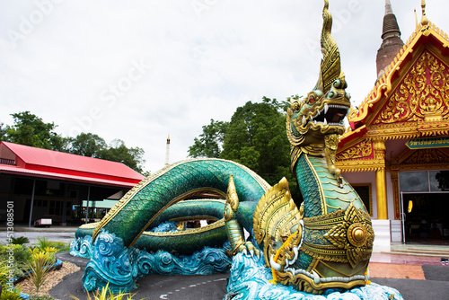 Ancient naga or antique naka statue of Wat Phra Kaew temple for thai people traveler travel visit and respect praying and blessing holy mystery worship at Chainat on May 27, 2020 in Chai Nat, Thailand