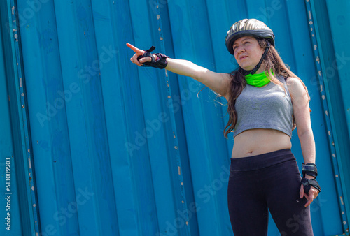 young sporty woman practicing inline skating in an urban setting