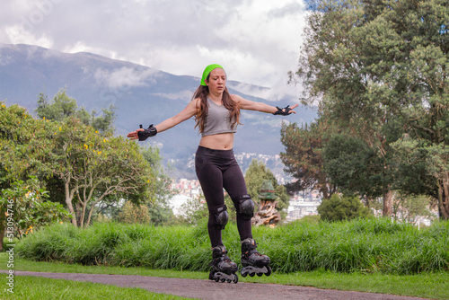 young sporty woman practicing inline skating in an urban setting. High quality photo