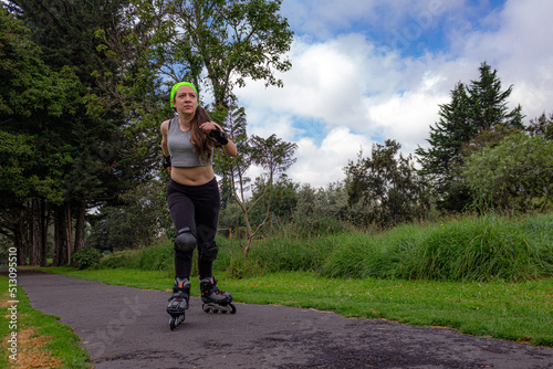 young sporty woman practicing inline skating in an urban setting. High quality photo