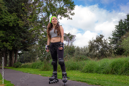 young sporty woman practicing inline skating in an urban setting. High quality photo