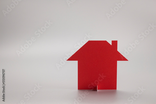 red house on gray background