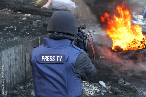 Journalist in protective helmet during Euromaidan im Kyiv, Ukraine on January 2014 photo