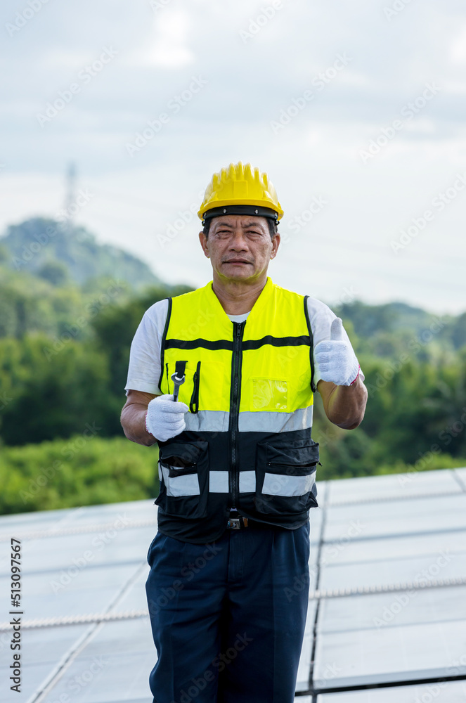 Engineer working setup Solar panel at the roof top. Engineer or worker work on solar panels or solar cells on the roof of business building