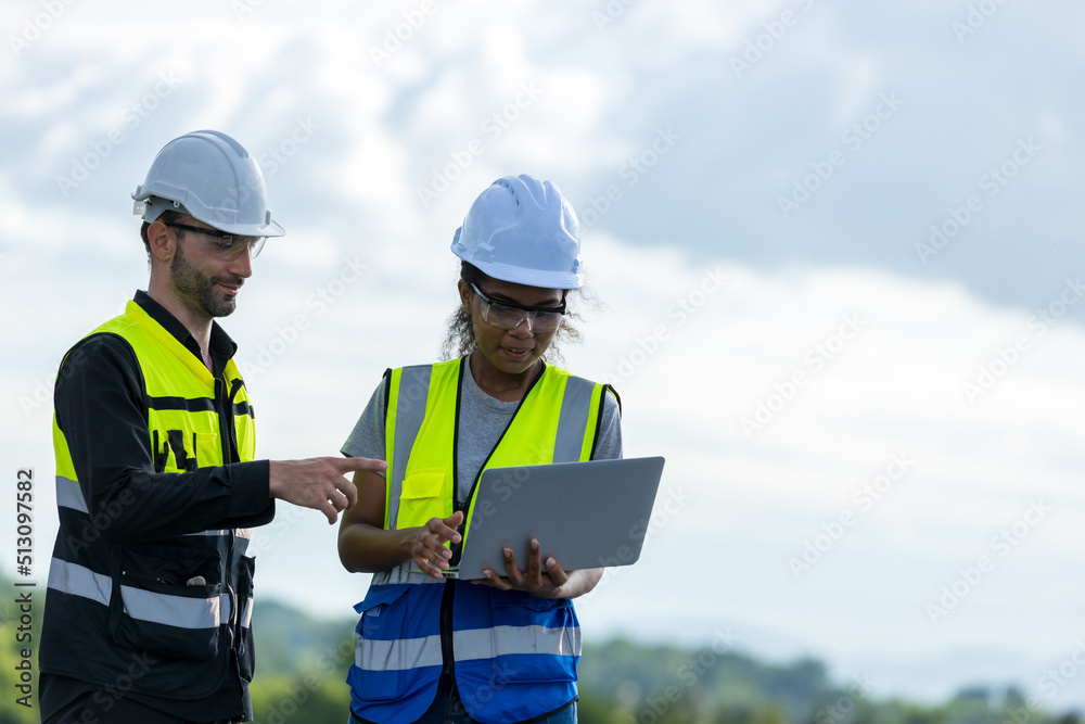 Engineer working setup Solar panel at the roof top. Engineer or worker work on solar panels or solar cells on the roof of business building