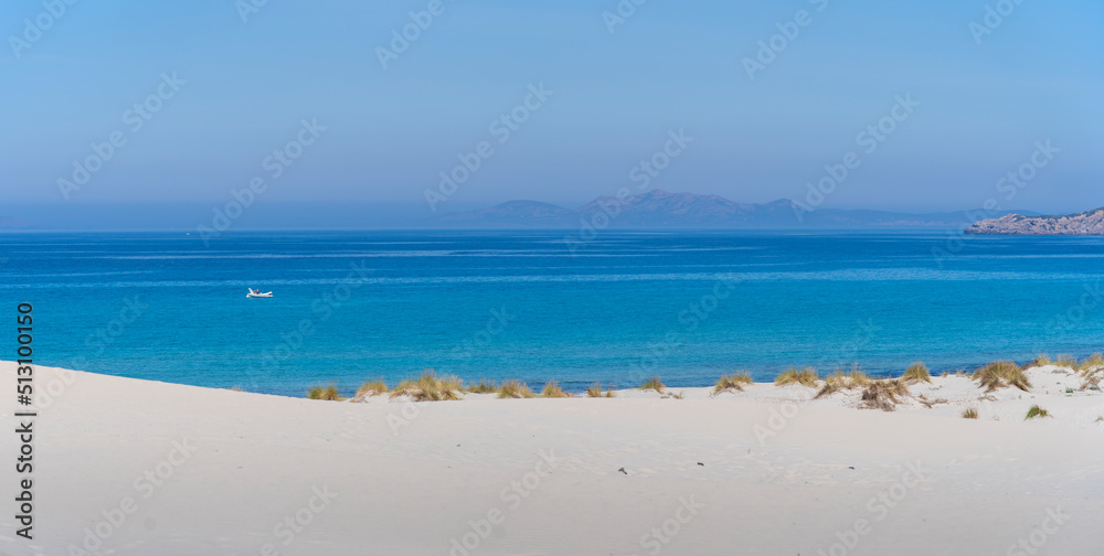 The wonderful white sand dunes of Porto Pino in Sardinia, Italy. Wild and uncontaminated environment. Tourist destination. Wonders of nature The wonderful white sand dunes of Porto Pino in Sardinia, Italy. Wild and uncontaminated environment. Tourist destination. Wonders of nature