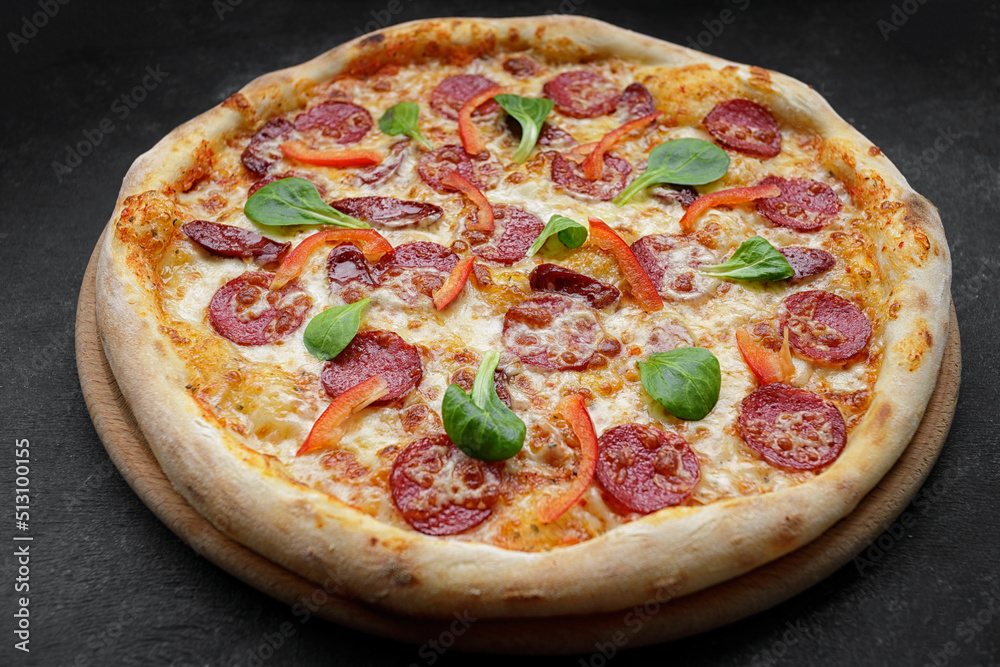 Pizza with sausage and bell pepper, close-up. studio light Pizza with sausage and bell pepper, close-up. studio light