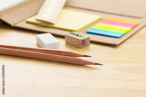 pencil on notebook concept education school equipment on wood table