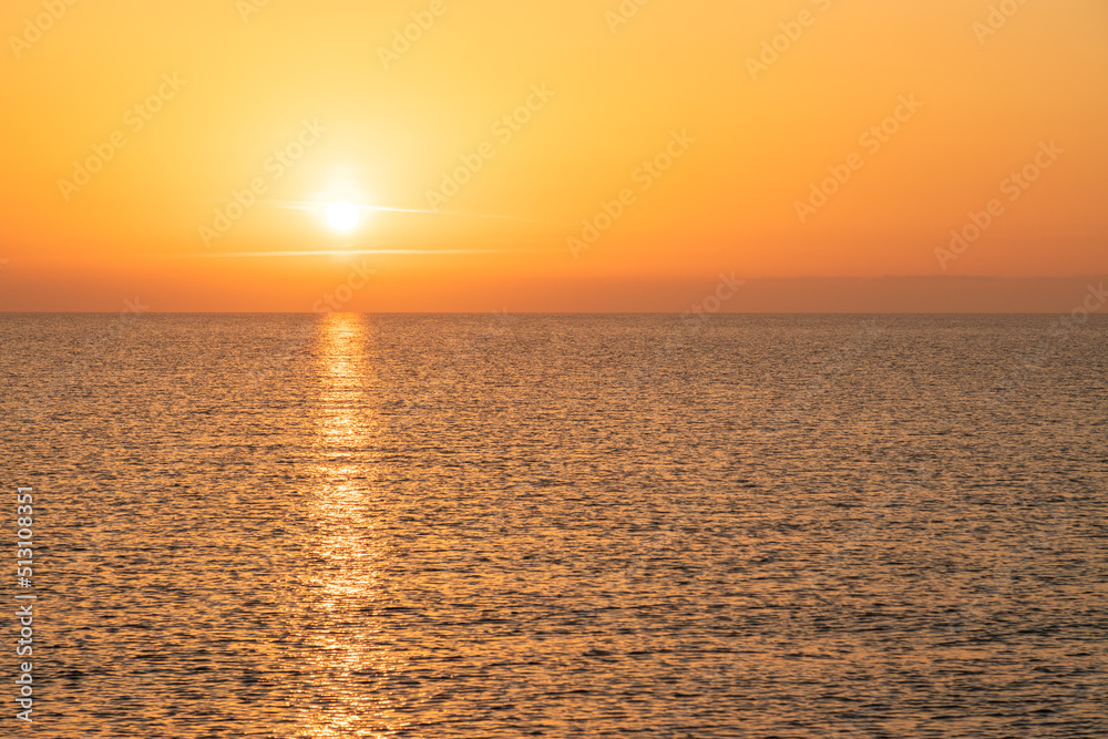 Sun rise at the beach. Sun rising at sea horizon. Golden hour.