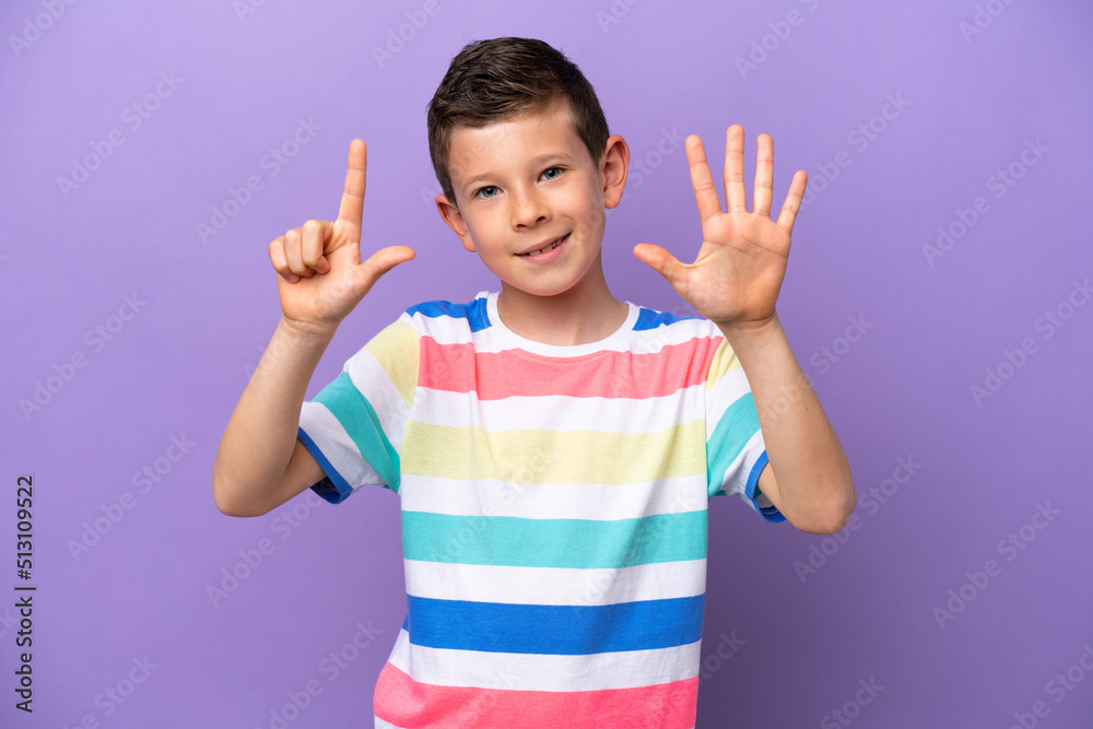 Little boy isolated on purple background counting seven with fingers Little boy isolated on purple background counting seven with fingers
