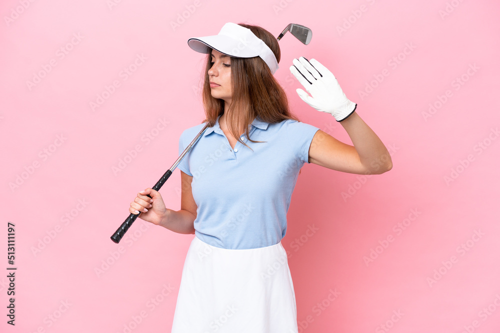 Young golfer player man isolated on pink background making stop gesture and disappointed Young golfer player man isolated on pink background making stop gesture and disappointed