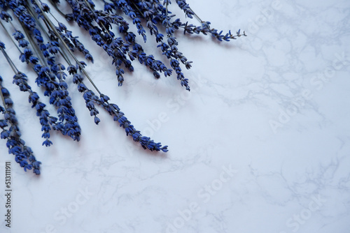  Lavender flowers on White marble background. Copy space. Top view, flat lay. blue dry Lavender flower background. photo