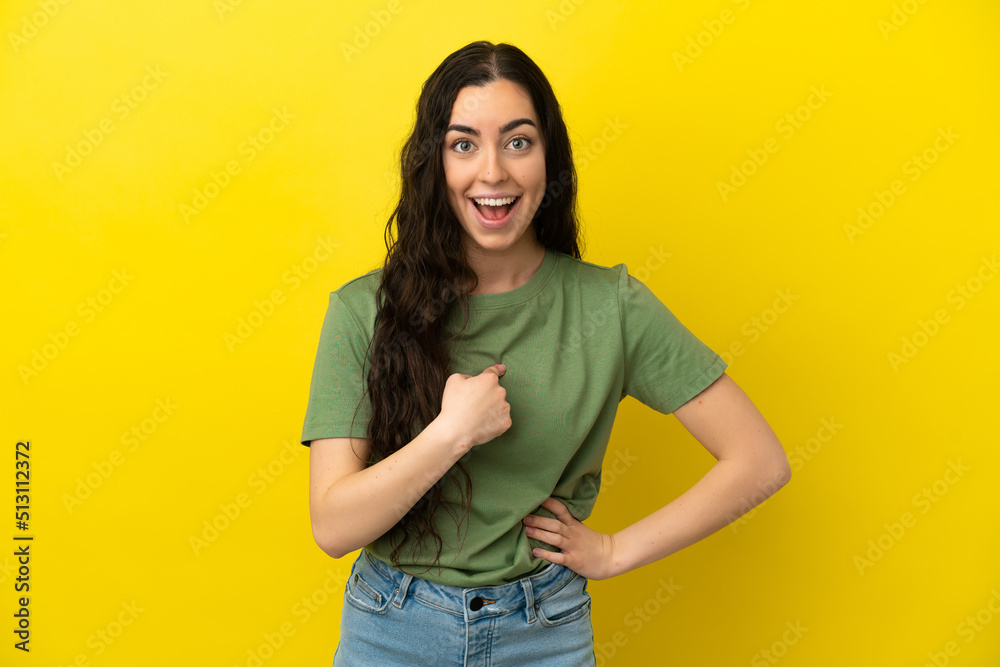 Young caucasian woman isolated on yellow background with surprise facial expression Young caucasian woman isolated on yellow background with surprise facial expression