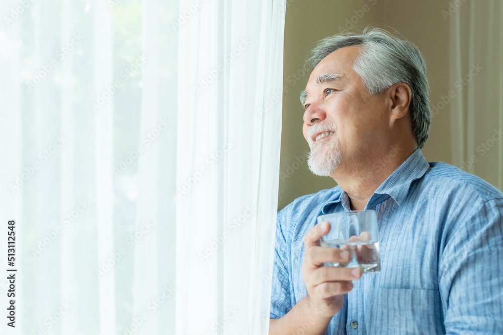 Senior man , old man feel happy drinking fresh water in the morning, enjoying time in his home indoor background - lifestyle senior happiness concept Senior man , old man feel happy drinking fresh water in the morning, enjoying time in his home indoor background - lifestyle senior happiness concept