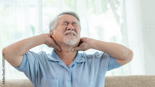Canvastavla Senior Asian man , old man he wake up and sat on the bed , He had pain in the na