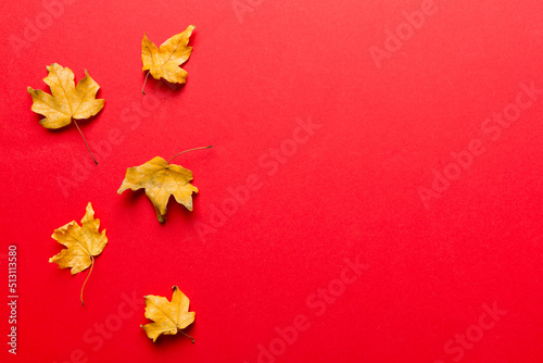 Autumn composition. Pattern made of dried leaves and other design accessories on table. Flat lay  top view