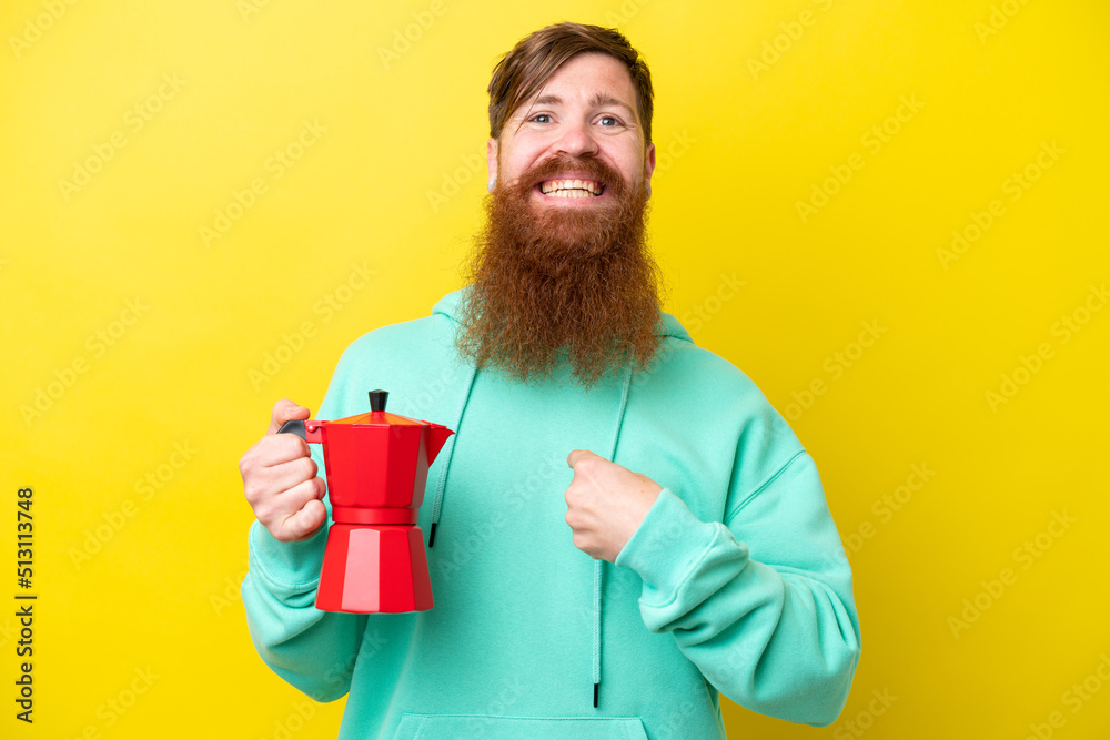 Redhead man with beard holding coffee pot isolated on yellow background with surprise facial expression Redhead man with beard holding coffee pot isolated on yellow background with surprise facial expression