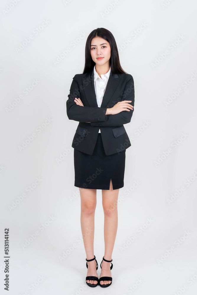 Full body length photo portrait of a business woman , beautiful Asian girl whit suit standing arms crossed isolated on white background , business people concept Full body length photo portrait of a business woman , beautiful Asian girl whit suit standing arms crossed isolated on white background , business people concept