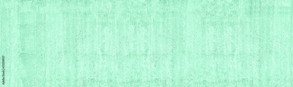 Pastel green mint painted old concrete wall. Rough messy cement slab wide texture. Panoramic pale aquamarine grunge background