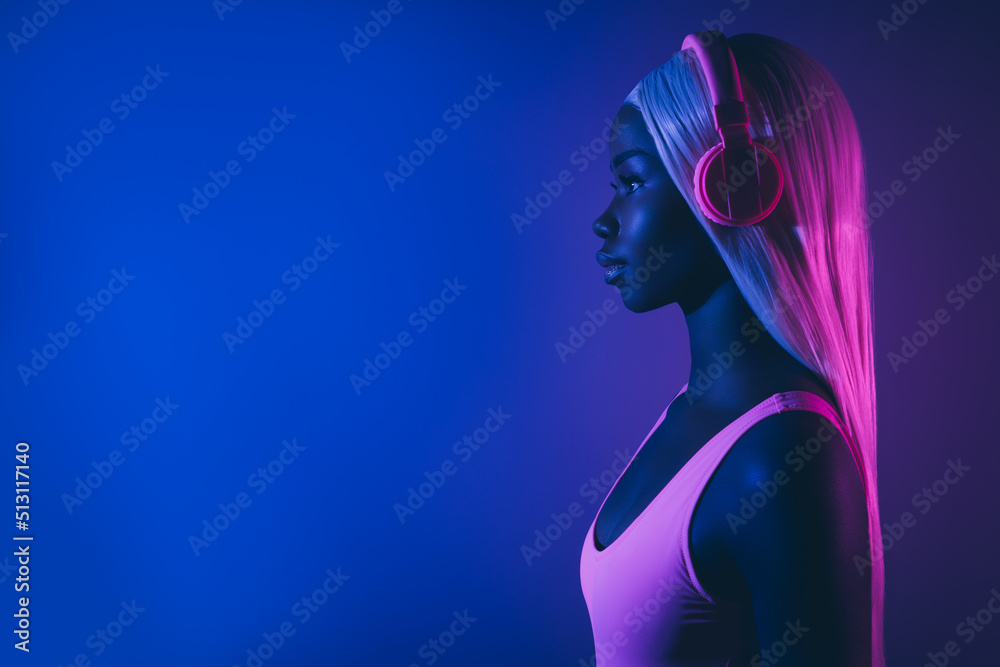 Youth generation millennial girl with straight white hairdo wig listen new hit song use mew technology headset look side Youth generation millennial girl with straight white hairdo wig listen new hit song use mew technology headset look side