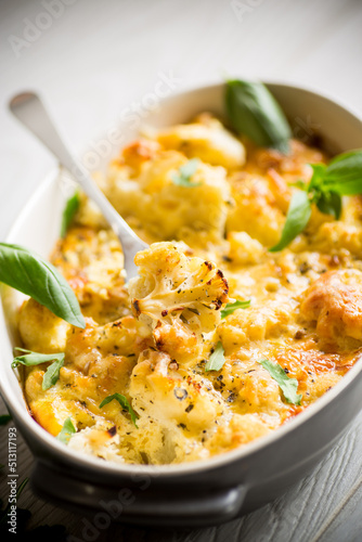 baked cauliflower with vegetables and cheese and scrambled eggs