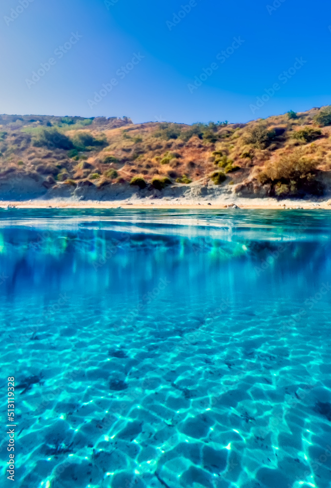 Crystal clear azure blue waters in Ghajn Tuffieha Bay in Malta