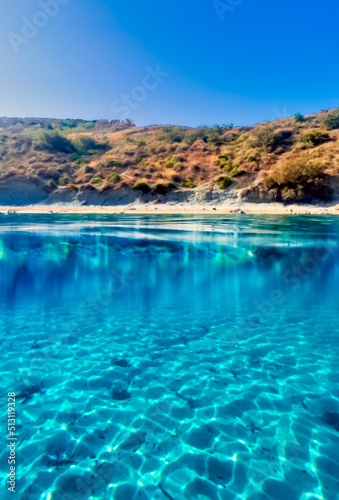 Crystal clear azure blue waters in Ghajn Tuffieha Bay in Malta © McCarthys_PhotoWorks