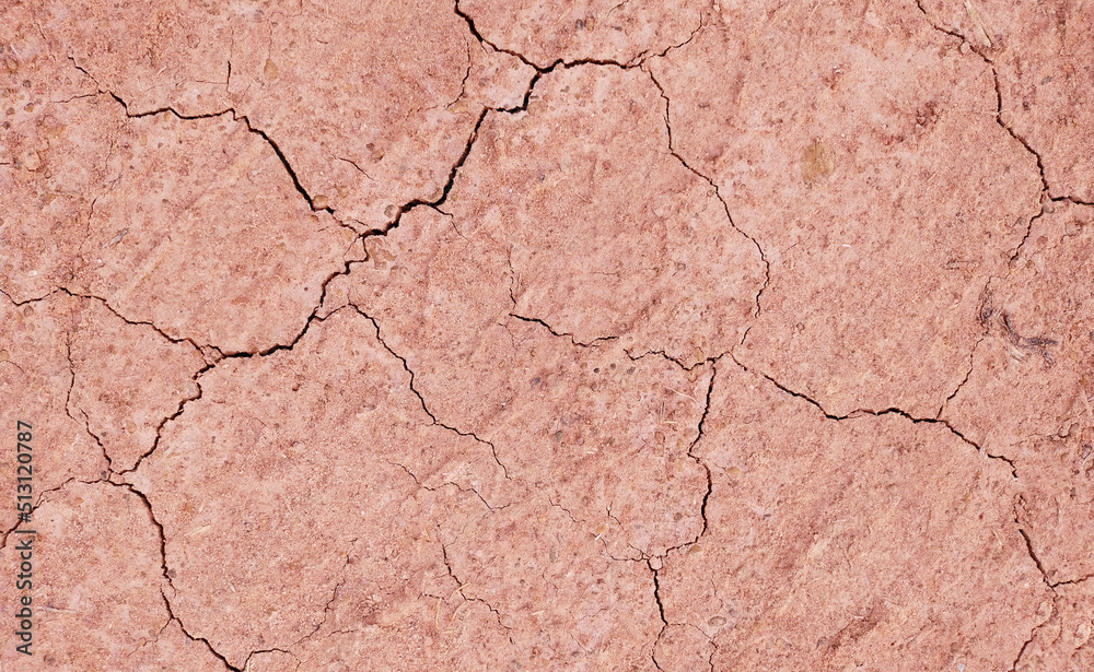 Obraz premium Cracked ground background in the top view for graphic design or wallpaper