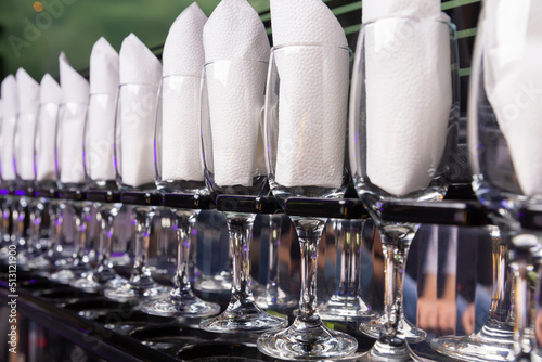 Wine glasses in the limousine with paper napkings inside. photo