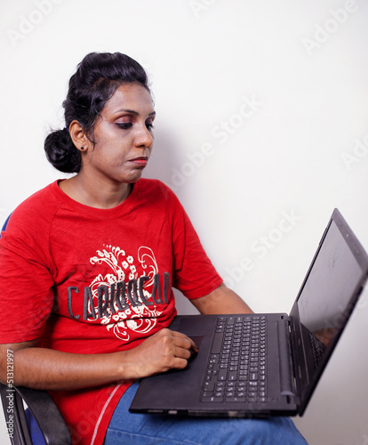 young woman working using computer laptop concentrated and confident