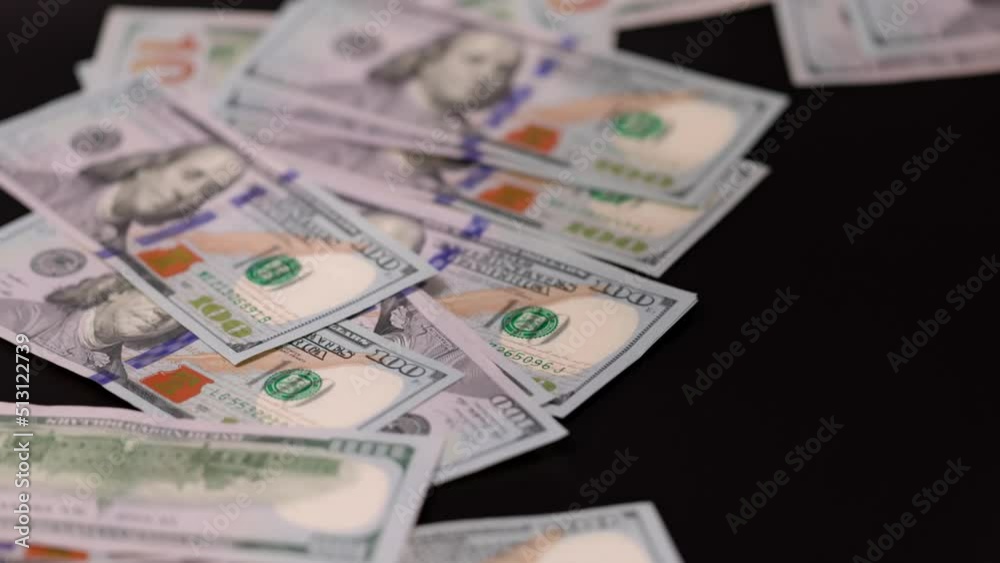 Close up view of dollar's banknotes falling on black background. Economy cash money concept. Sweden. Close up view of dollar's banknotes falling on black background. Economy cash money concept. Sweden.