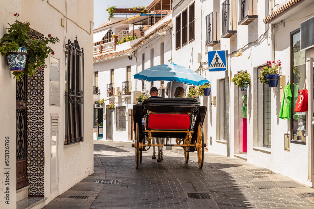 Guided tour through the picturesque streets of the Spanish mountain village of Mijas, by horse and carriage. - obrazy, fototapety, plakaty 