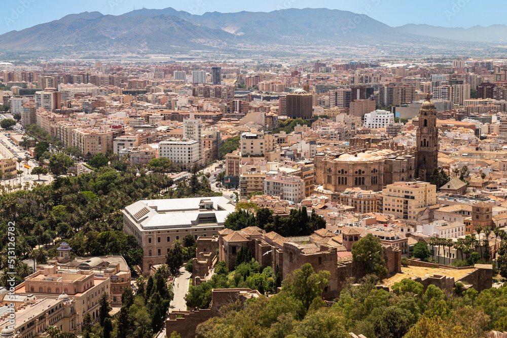 Cityscape Málaga surrounded by the mountains overlooking the cathedral and the citadel of Alcazaba; Spain.