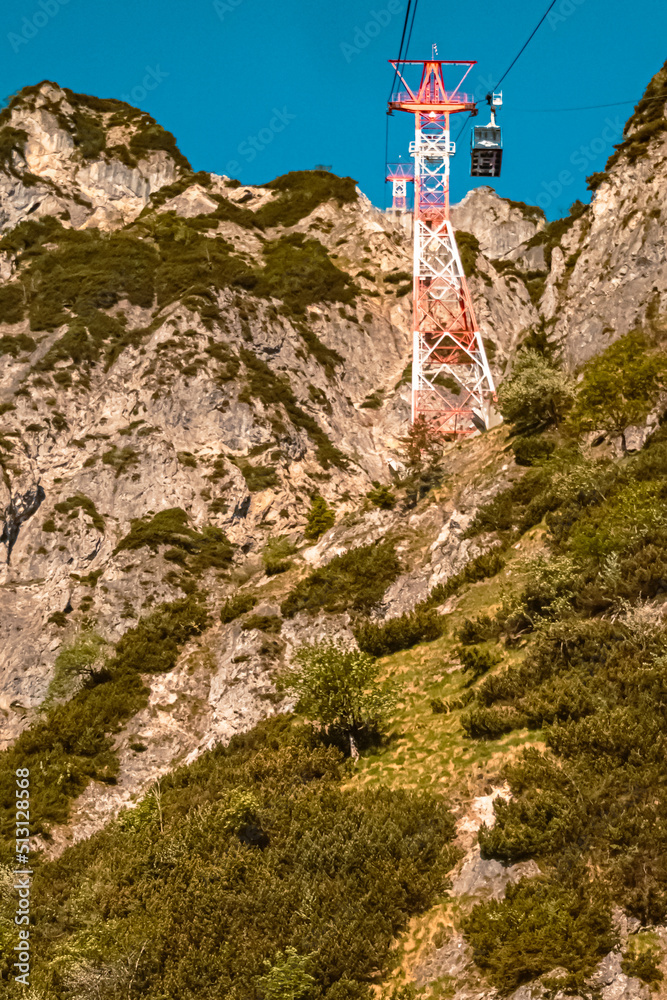 Beautiful alpine summer view with details of a cable car support at the famous Untersberg mountain, Groedig, Salzburg, Austria