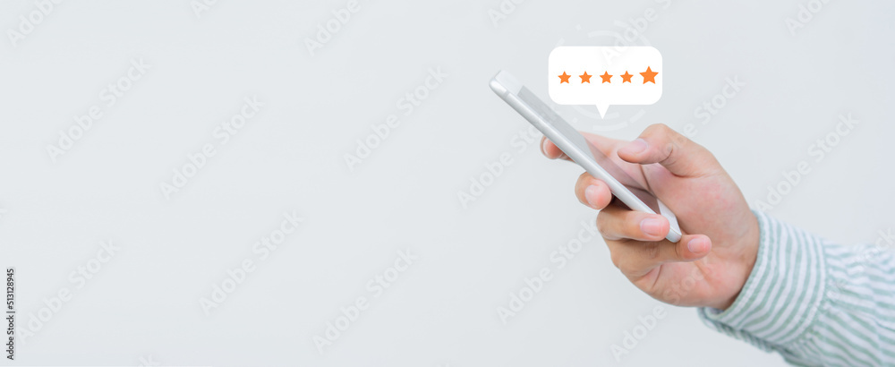 close up on customer man hand pressing on smartphone screen with gold five star rating feedback icon and press level three rank (good) for give score point to review the service business concept - obrazy, fototapety, plakaty 