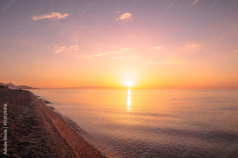 Lovely romantic warm sunrise at the Sicilian East Coast in Italy, Europe 
