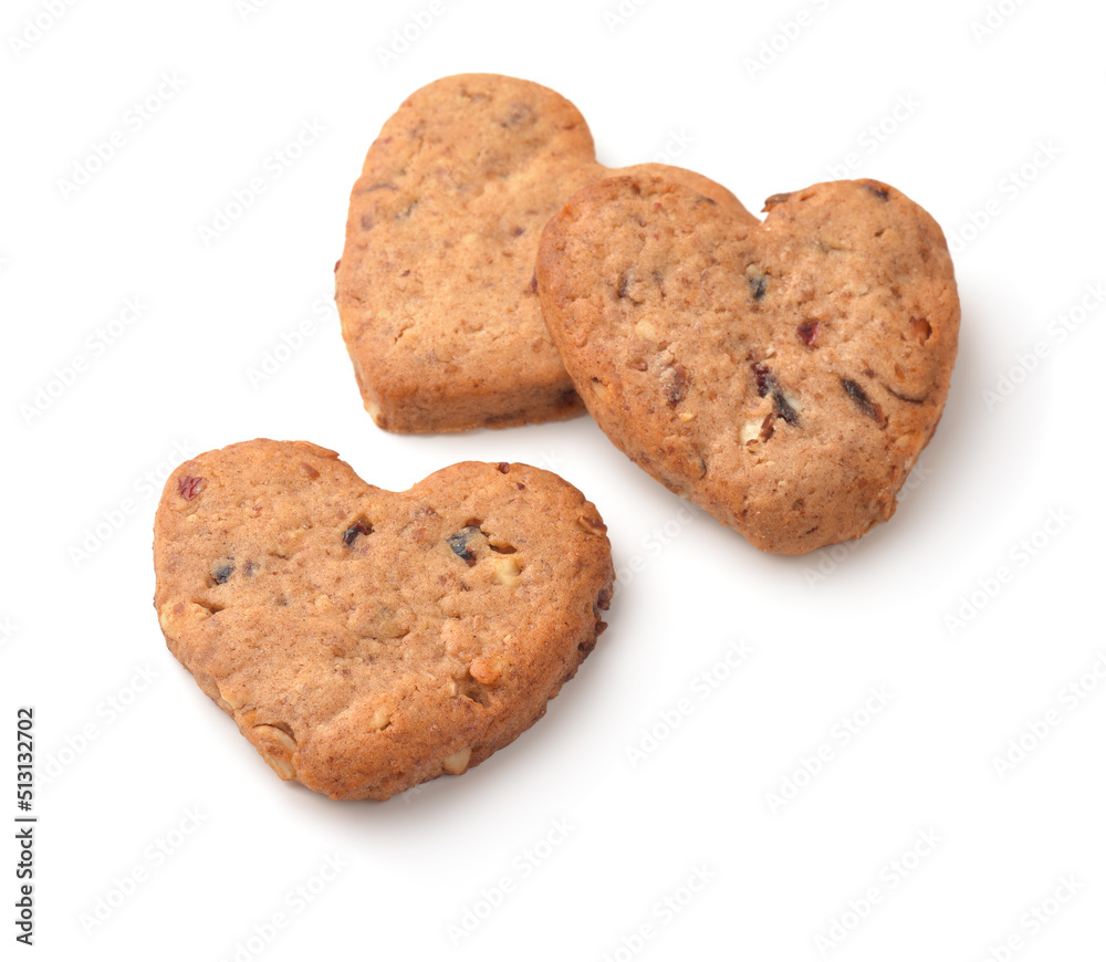 Three homemade oatmeal heart cookies with nuts and raisins