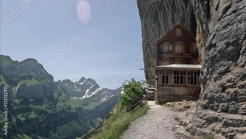 Ebenalp is a famous tourist destination in the canton of Appenzell in Switzerland. The famous mountain lodge in the middle of the hiking trail, Aescher Wildkichi photo