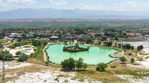 Panoramic view onto artificial lake and town Pamukkale, Turkey. 