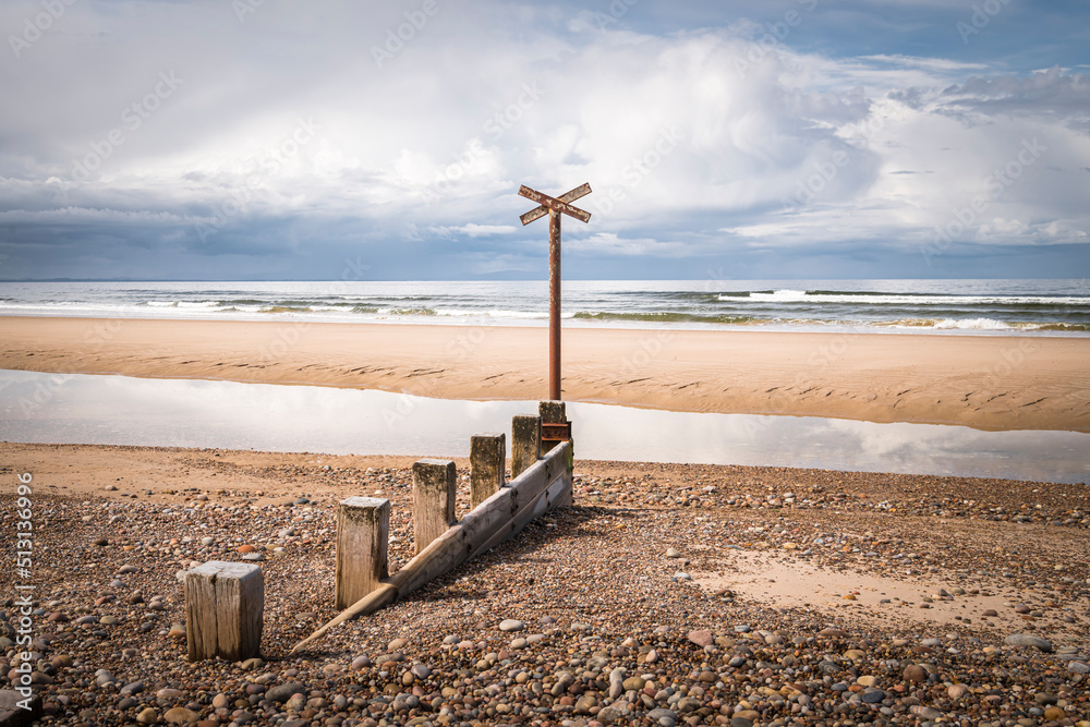 A sunny summer HDR image of sea defences,Groynes, on Findhorn Beach, Moray, Scotland