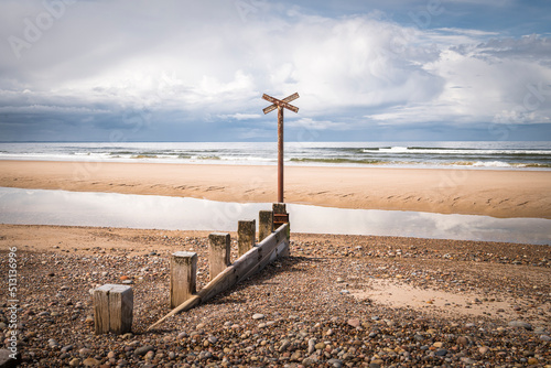 Fotografiet A sunny summer HDR image of sea defences,Groynes, on Findhorn Beach, Moray, Scot