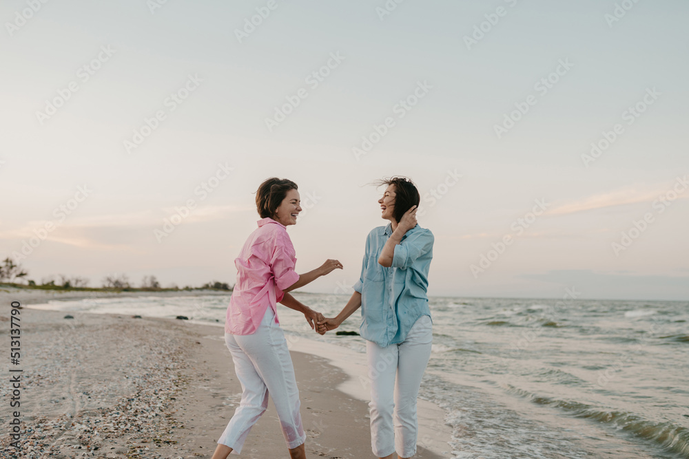 two young women having fun on the beach two young women having fun on the beach