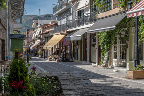 Fototapeta Naklejka Na Ścianę i Meble -   Quiet street view in the small mountainous town of Kalavrita, located in the east-central part of Achaea region, Peloponnes peninsula, West Greece, Greece.