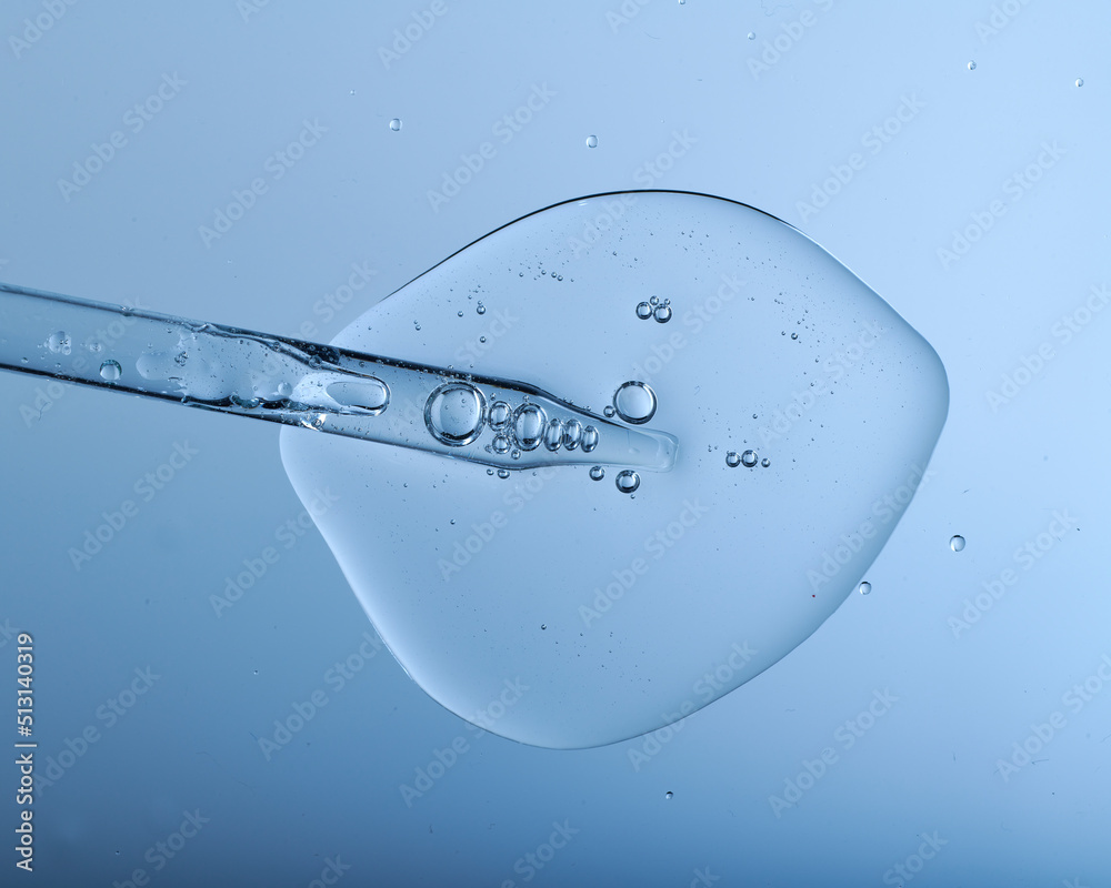 Pipette with bubbles and clear formulation being expelled. Clear liquid