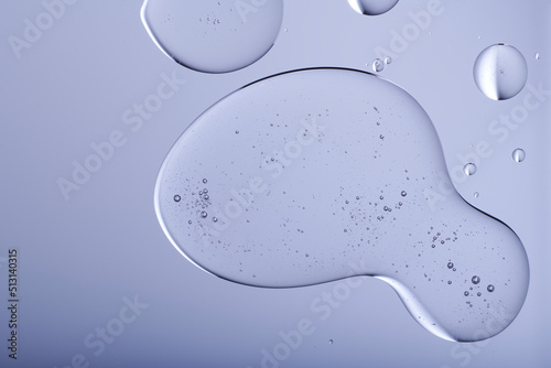 Blob with bubbles and clear formulation on a transparent background. Clear liquid with bubbles resembling glycerin, hyaluronic acid or keratin in laboratory or scientific setting.  photo