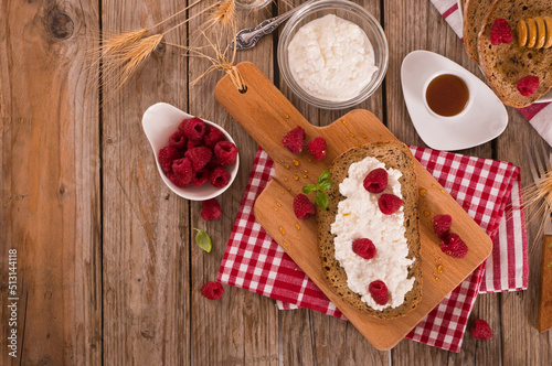 Rye bread with cottage cheese and raspberries.