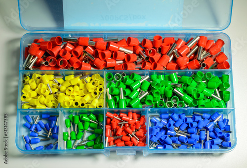 Box with colorful ferrules on the white background - close up picture. Selective focus.