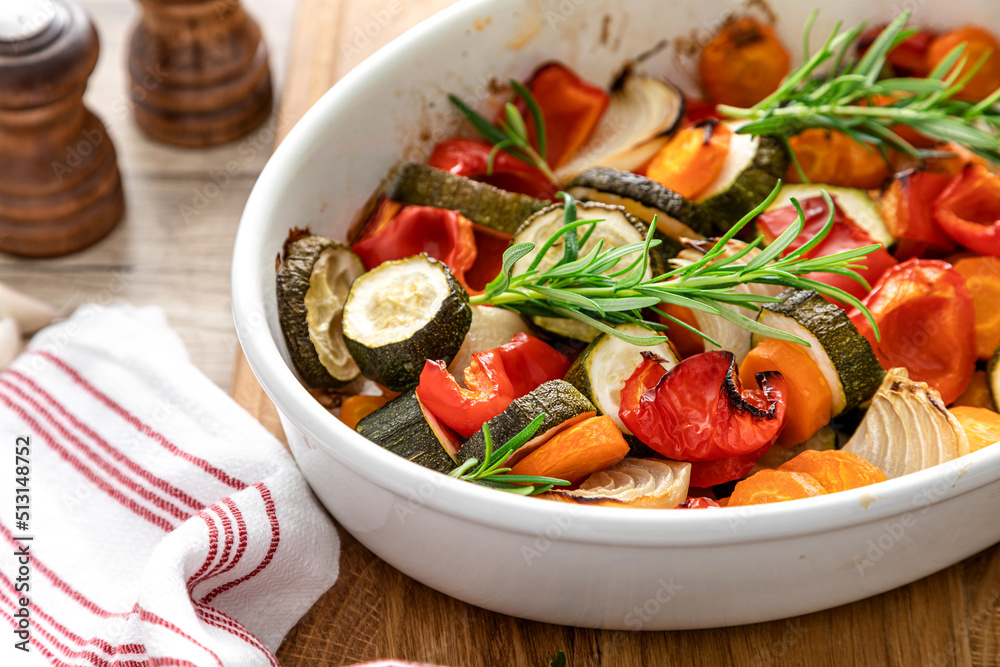 Baked vegetables mix. Oven roasted carrots, onion, zucchini and bell pepper. Baked vegetables mix. Oven roasted carrots, onion, zucchini and bell pepper.